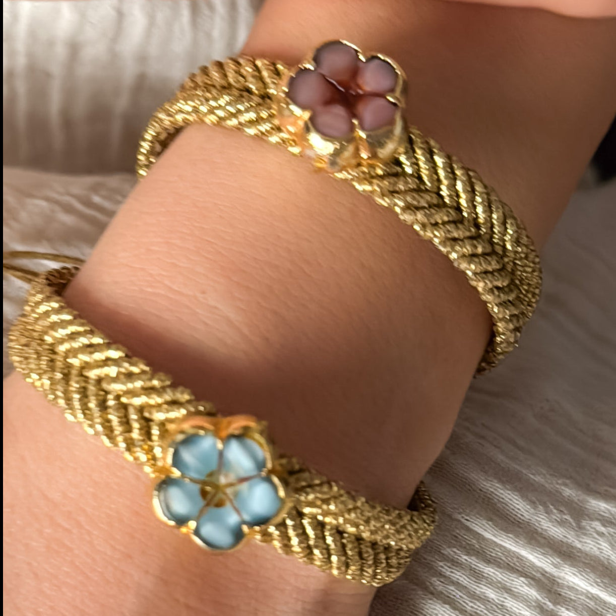 Gold bracelets with floral designs 